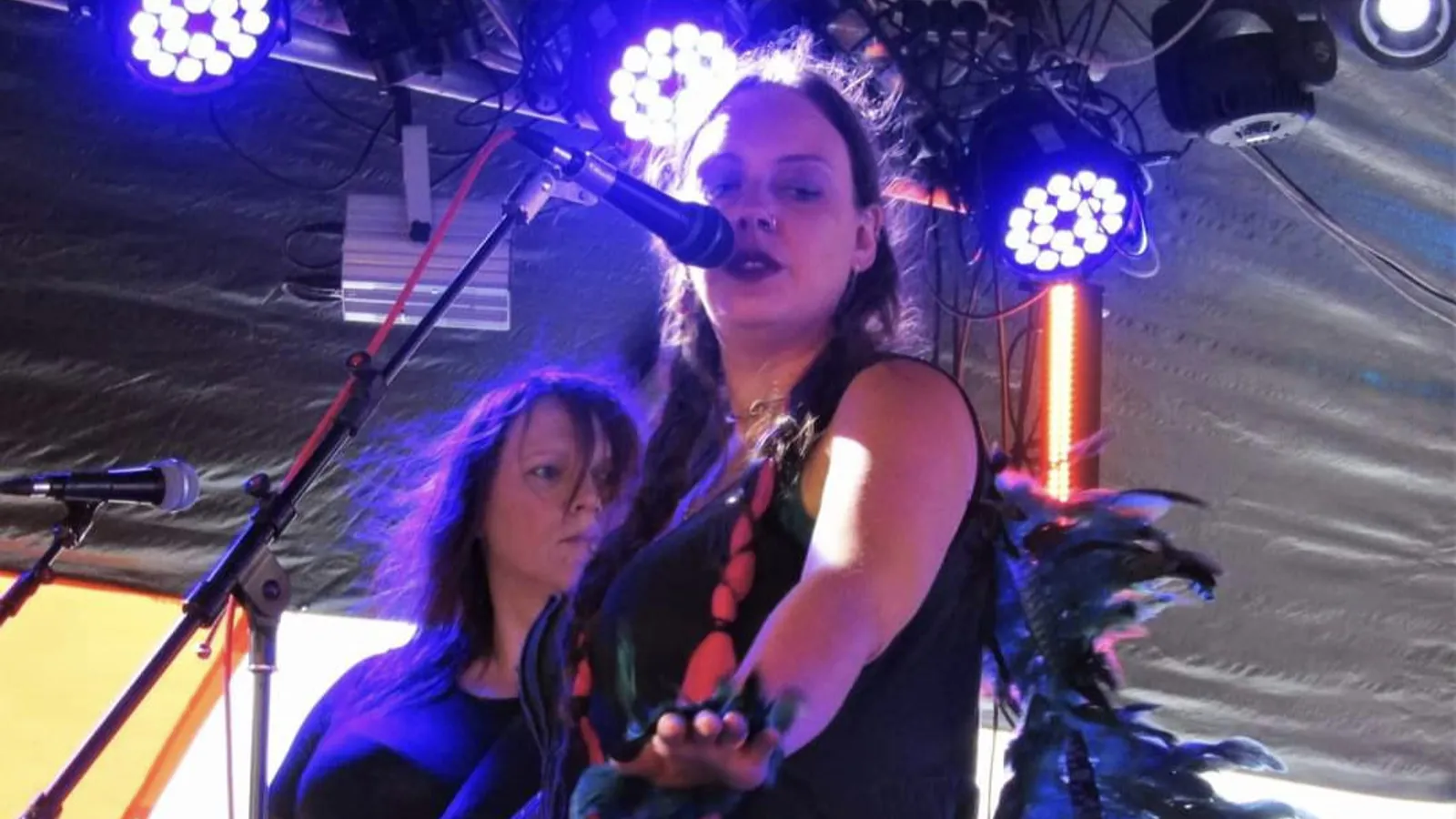 Mora performing live on stage